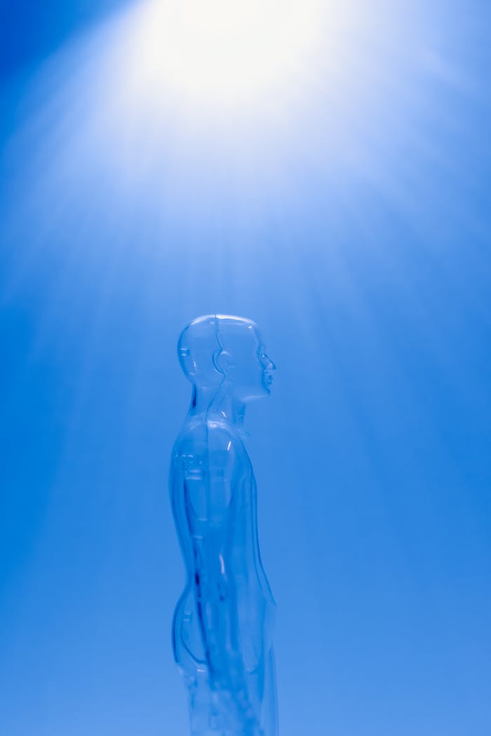 cta-02 A transparent human figure under a bright blue light creating a futuristic ambiance.